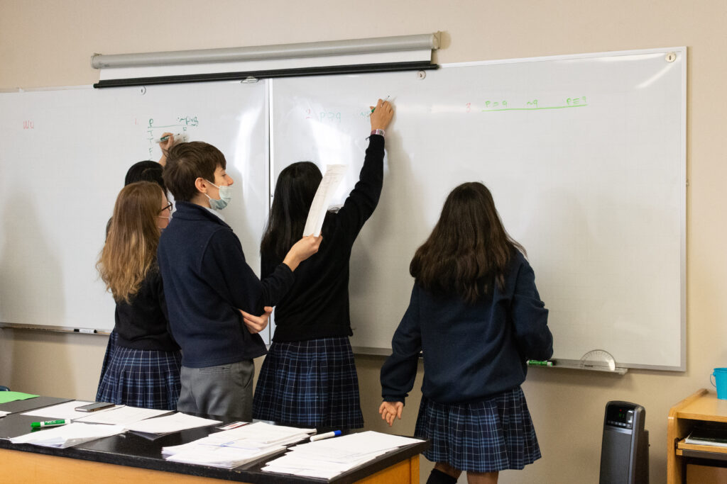 8th grade students work on truth tables at the beginning of Logic class.